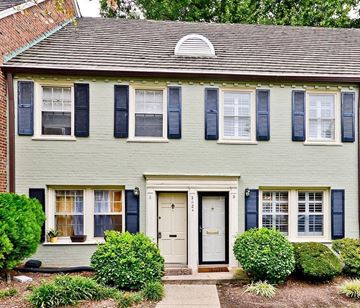 Washington apartment for rent - a white house with blue shutters and a white door