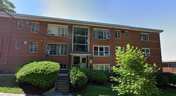 Washington apartment for rent - the front of a red brick building with stairs