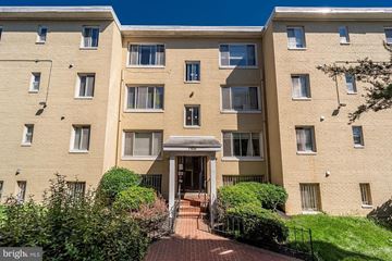 Washington apartment for rent - a large brick apartment building with a walkway in front