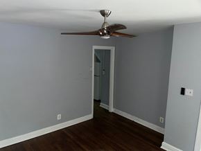Washington apartment for rent - a room with gray walls and a ceiling fan