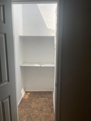 Washington apartment for rent - A white door is open to a room with a carpeted floor.