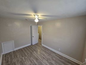 Washington apartment for rent - A room with a light on and a door open.