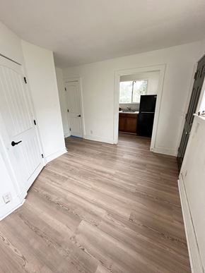 Lafayette apartment for rent - A room with wooden flooring and white walls.