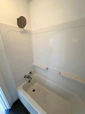 Lafayette apartment for rent - A white bathroom with a shower and a bathtub.