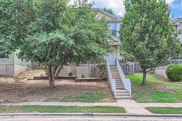 Austin house for rent - a house with stairs and trees in front of it