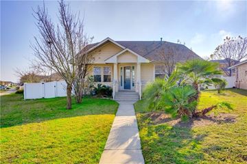 Pflugerville apartment for rent - A house with a white picket fence and a tree in front.