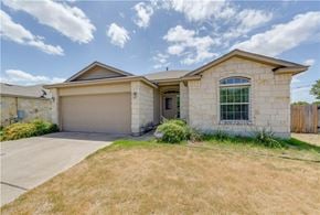 Leander apartment for rent - A house with a garage and a window.
