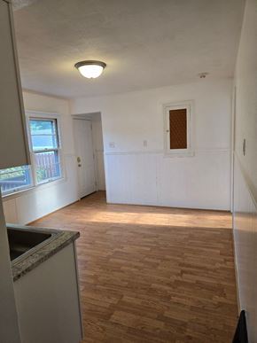 Saint Ann house for rent - an empty kitchen and living room with a window