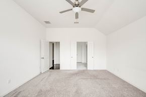 Georgetown apartment for rent - A spacious room with a ceiling fan and carpeted floor.