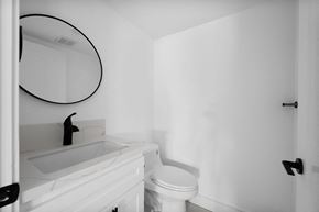 Los Angeles apartment for rent - a small bathroom with a white sink and toilet and a mirror