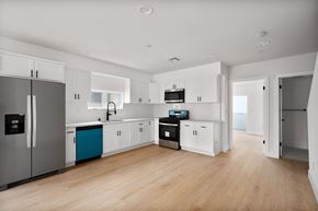 Los Angeles apartment for rent - a kitchen with white cabinets and stainless steel appliances