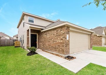 Houston apartment for rent - a brick house with a sidewalk in front of it