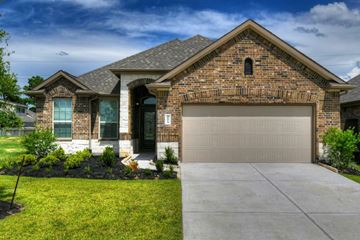 Houston apartment for rent - a house with a garage door in front of it