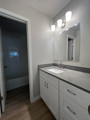 Fort Collins apartment for rent - a bathroom with a sink and a mirror and a shower