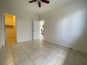 Honolulu apartment for rent - A room with a ceiling fan and tile flooring.