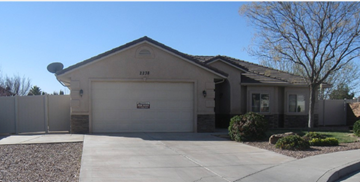 St George house for rent - a house with a driveway and a garage door