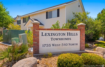 St George house for rent - a sign townhomes in front of a house