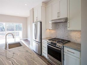 Dulles apartment for rent - A kitchen with a countertop and stainless steel appliances at City Center Townes
