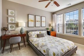 Dulles apartment for rent - a bedroom with a bed and a ceiling fan