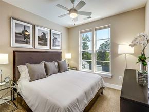 Dulles apartment for rent - a bedroom with a bed and a ceiling fan