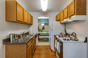 Rockville apartment for rent - a kitchen with a stove refrigerator and sink