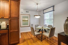 Greenbelt apartment for rent - a dining room with a table and chairs