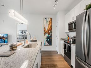 Port St. Lucie apartment for rent - a kitchen with granite counter tops and stainless steel appliances