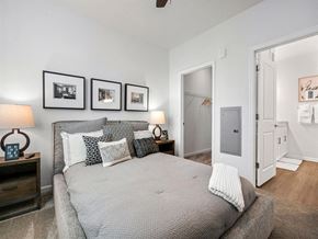 Port St. Lucie apartment for rent - a bedroom with a bed and some pictures on the wall