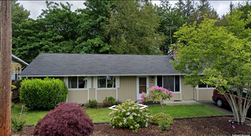 Bothell house for rent - A house with a grey roof and a red car parked in the driveway.