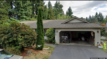 Bothell house for rent - A house with a garage and a car parked in front.