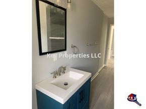 Knoxville house for rent - A bathroom with a sink and a mirror.