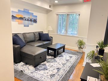Washington apartment for rent - a living room with a couch and a coffee table