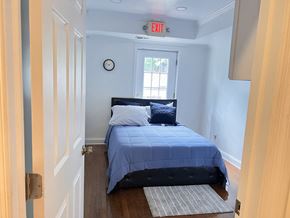 Washington apartment for rent - a bedroom with a bed and a window