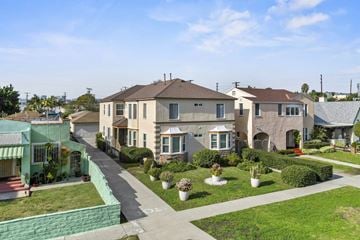 Los Angeles apartment for rent - A row of houses with a green lawn in front.