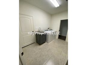 Loudon house for rent - A small, empty room with a sink and a door.