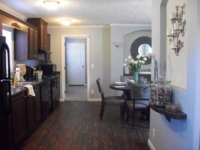 Sanford apartment for rent - Dining Area and Kitchen at Pine Village Rental Home Community in Sanford, NC