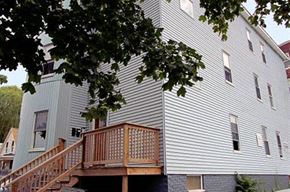 Worcester apartment for rent - a white house with a porch and a tree