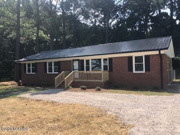 Wilson house for rent - a small brick house with a porch and a