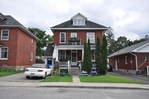 Smiths Falls apartment for rent - a house with a white car parked in front of it