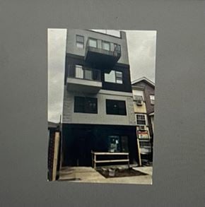 Brooklyn apartment for rent - a picture of a building with a bench in front of it