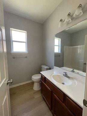 Temple house for rent - a bathroom with a sink and a toilet and a mirror
