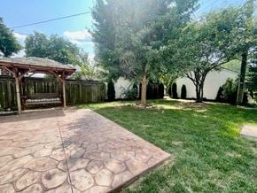 Louisville house for rent - a backyard with a patio and a gazebo