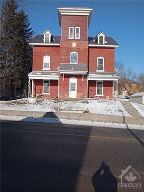 Cobden apartment for rent - a red brick house on the side of a street