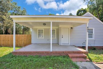 Fayetteville house for rent - the front of a white house with a porch