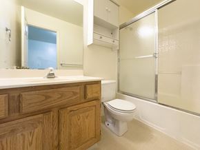 Orem house for rent - A bathroom with a toilet, sink, and shower.