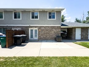 Orem house for rent - A house with a grey roof and a white door.