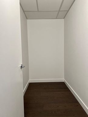Vancouver apartment for rent - a small room with white walls and a wooden floor