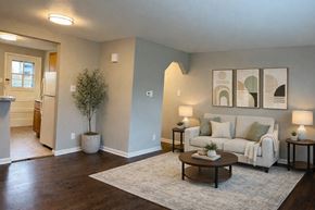 Arvada apartment for rent - a kitchen with white cabinets and a white refrigerator