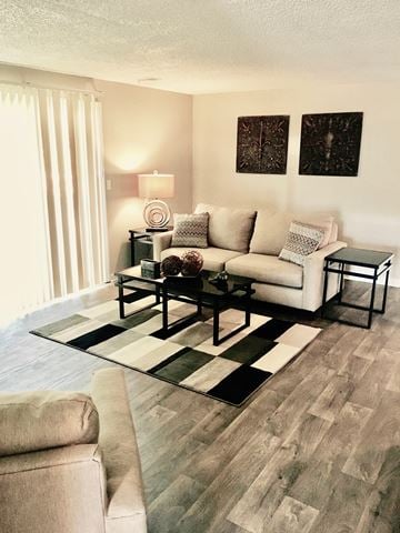 Greeley apartment for rent - a living room with a couch and a table