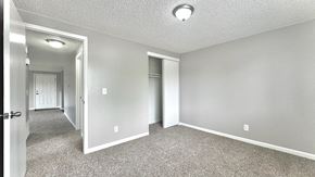 Greeley apartment for rent - a brick apartment building with balconies and a blue sky